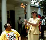 Janet Reno carries Spirit of ADA Torch