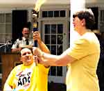 Spirit of ADA Torch handed to Janet Reno 