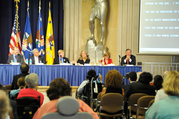 A group of people listen to a panel disscussion