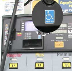 photo - close up of button on gas pump with access symbol