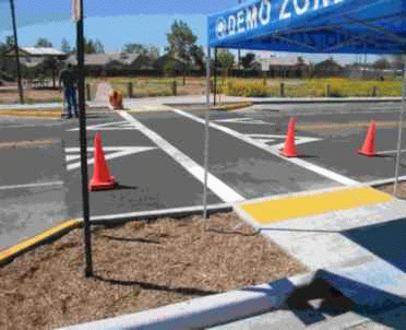 Accessible sidewalk and curb cut with raised platform