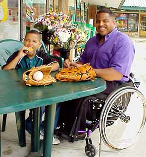 Cover Photo: man with disability and son