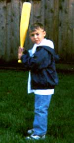 Jeremy stands with a baseball bat