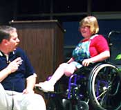 girl using wheelchair being interviewed