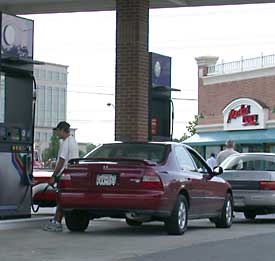 photo - man pumping self-service gas 