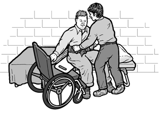 image of a shelter worker helping with a transfer to the cot