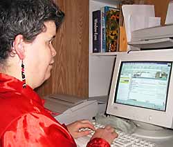 photo - woman viewing website on computer monitor