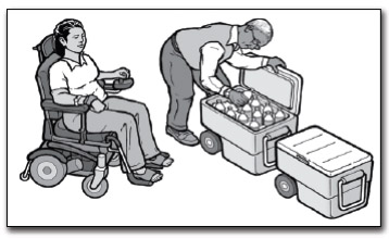 A woman in a power wheelchair watches a man get a drink out of a cooler