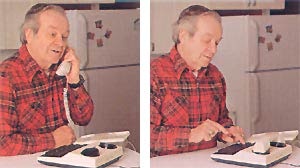a man listens on a phone, then types a response on a keypad