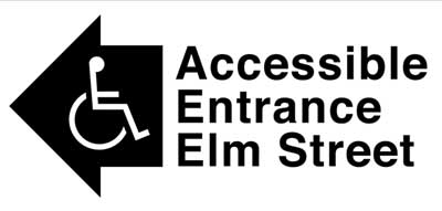 sign at an inaccessible entrance identifies the location of the nearest accessible entrance